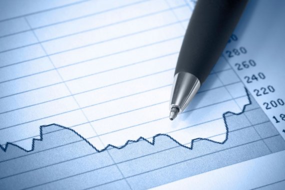 paper with printed graph and a black pen
