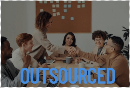 A group of diverse professionals in a meeting room, with two individuals shaking hands across a table, symbolizing a business agreement or collaboration, and the word 'OUTSOURCED' prominently displayed across the image.